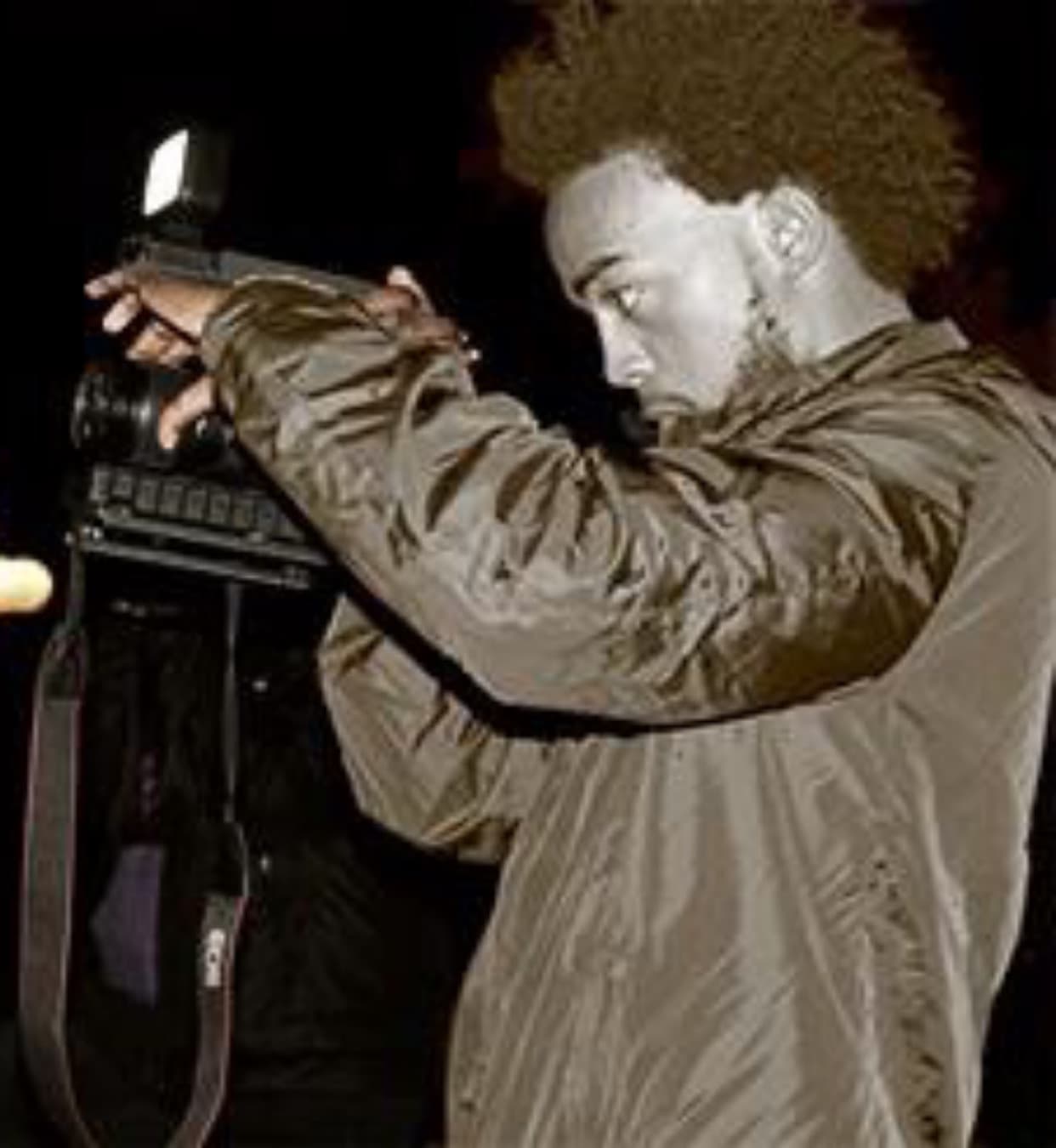 Ralph Martin photographing at a nighttime shoot